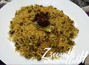 A picture of Sambar Masala and Green Peas Rice.