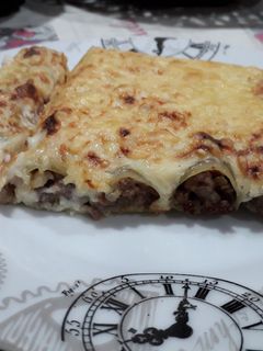 Una foto de Canelones de carne y champiñones