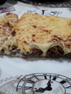 Una foto de Canelones de carne y champiñones