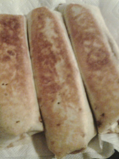 A picture of Chili cheese burritos.