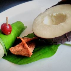 A picture of The Amazing Trio (Coconut mousse in Chocolate shells, Gulkand, Wontons and a Paan Cheesecake).