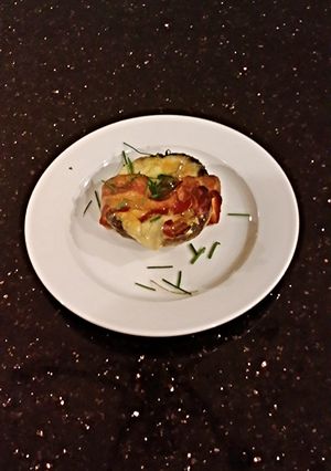 A picture of Bacon Wrapped Cheese Stuffed Mushrooms.