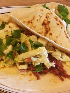 A picture of Spicy Corned Beef Tacos with an Avocado Dressing Coleslaw.