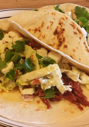 A picture of Spicy Corned Beef Tacos with an Avocado Dressing Coleslaw.