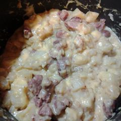 A picture of Sautéed Sausage and Potatoes w/cheese.
