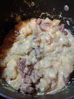 A picture of Sautéed Sausage and Potatoes w/cheese.