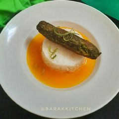 A picture of Hara Bhara Kebab served with Rice and Carrot-Orange broth.
