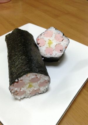 A picture of Lucky Ehoumaki Sushi Rolls with Flower Petals.