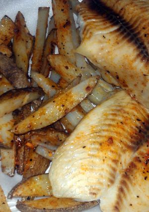 A picture of fish and fries.