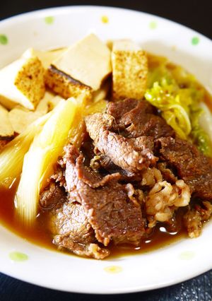 A picture of Beef and Tofu Sukiyaki-Style with Napa Cabbage and Scallions.