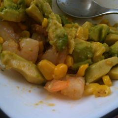 A picture of Avocado, shrimp, corn salad.