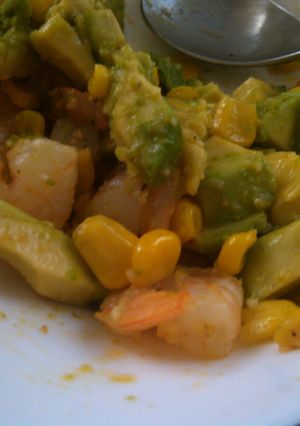 A picture of Avocado, shrimp, corn salad.