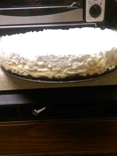 A picture of Vanilla bean cheesecake w/ white chocolate mousse..