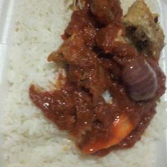 A picture of White rice and croka fish.