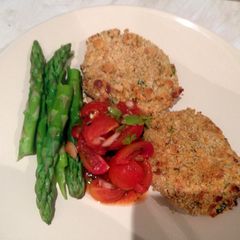 A picture of Salmon fishcakes and salsa.