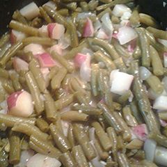 A picture of Red new potatoes with green beans.