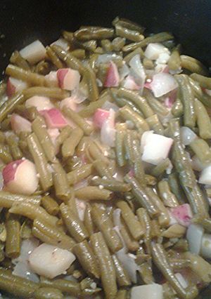 A picture of Red new potatoes with green beans.