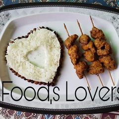 A picture of Beef pakora on skewers.