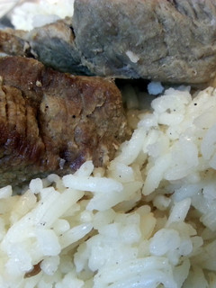A picture of smoked rice with beef.