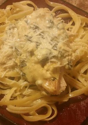 A picture of Spinach Artichoke Chicken with fettuccine.