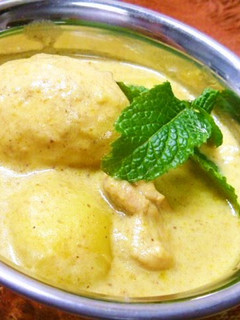 A picture of Boiled Egg and Potato Yellow Curry.