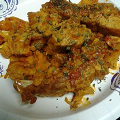 A picture of Pork vindaloo with cauliflower.