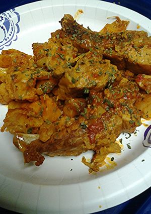 A picture of Pork vindaloo with cauliflower.