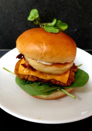 A picture of My Big Chicken, Halloumi,Bacon,Red Cheese Slice on Brioche Bun🤩.