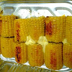 A picture of Roasted corn on cobbs.