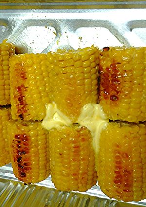 A picture of Roasted corn on cobbs.