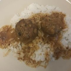 A picture of Meatballs and brown gravy.