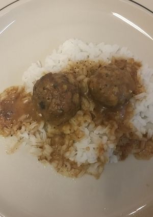 A picture of Meatballs and brown gravy.