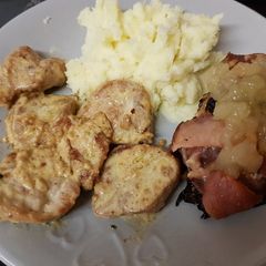 A picture of Garlic & Ginger Pork with Creamy sauce. And mashed potato.