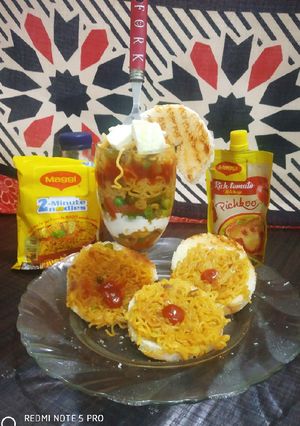 A picture of Maggi coins with bowl of veg noodles.