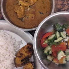 Salmon fish fry and curry with rice A picture of Salmon fish fry and curry with rice.