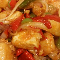 A picture of Stir fry sweet chili glazed tofu with peppers & onions and Thai.