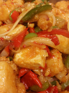 A picture of Stir fry sweet chili glazed tofu with peppers & onions and Thai.