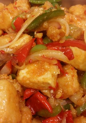 A picture of Stir fry sweet chili glazed tofu with peppers & onions and Thai.