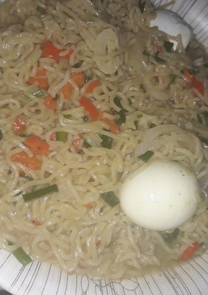 A picture of Noodles with boiled egg.