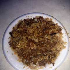 A picture of Barbeque pulled pork over rice.