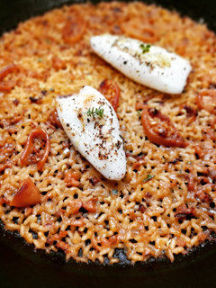 Una foto de Arroz con calamarcitos
