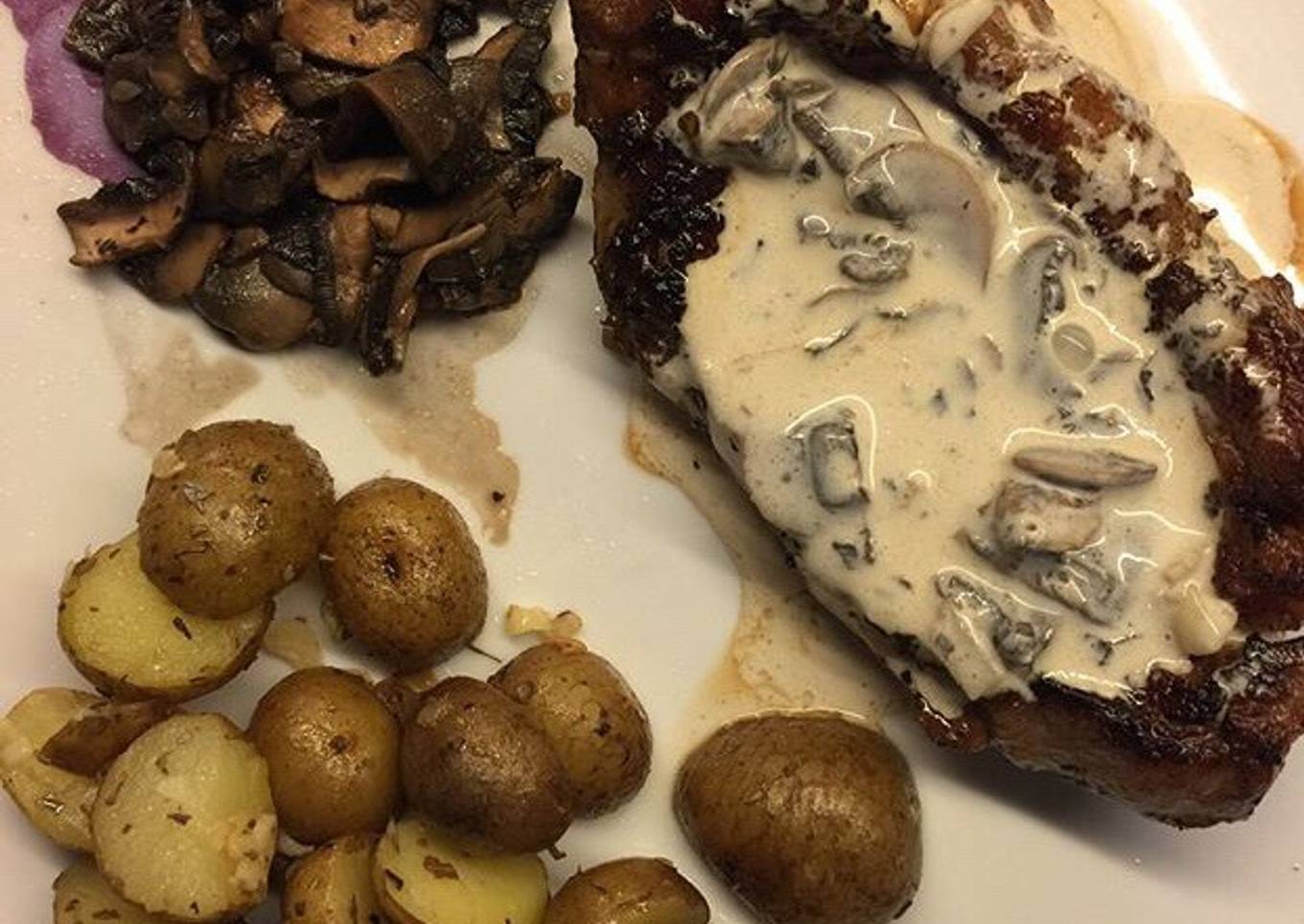 Sirloin steak with mushroom sauce and portobello saute