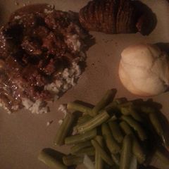 A picture of Beef tips and rice.