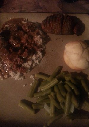 A picture of Beef tips and rice.