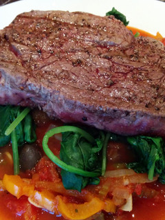 A picture of Seared steak with celery & pepper caponata.
