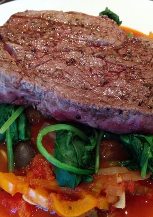 A picture of Seared steak with celery & pepper caponata.