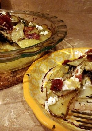 A picture of Potato pie stuffed with chicken, goat cheese and kale.