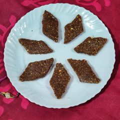 A picture of Peanuts and fried gram Burfi.