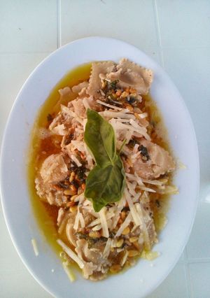A picture of Mushroom Ravioli with a Buttery Sauce.