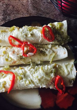 A picture of Chicken Enchiladas With Sour Cream White Sauce.